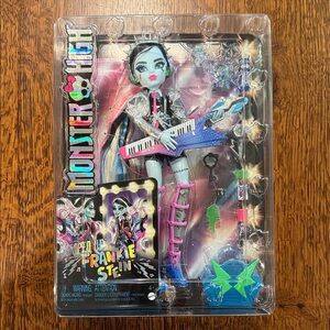Monster High Frankie Stein Doll with Blue and Pink Guitar